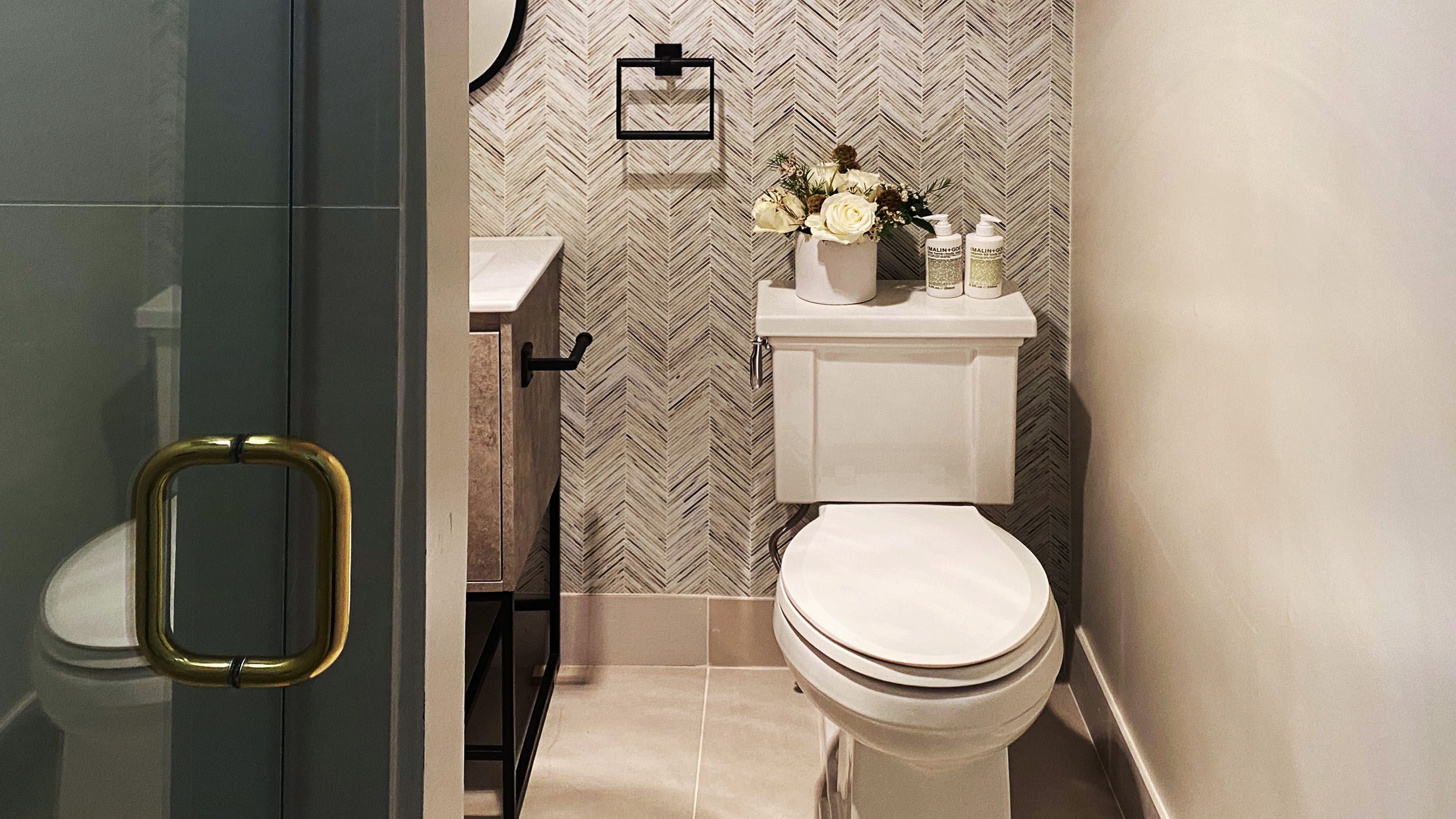 modern bathroom with glass shower door and single toilet