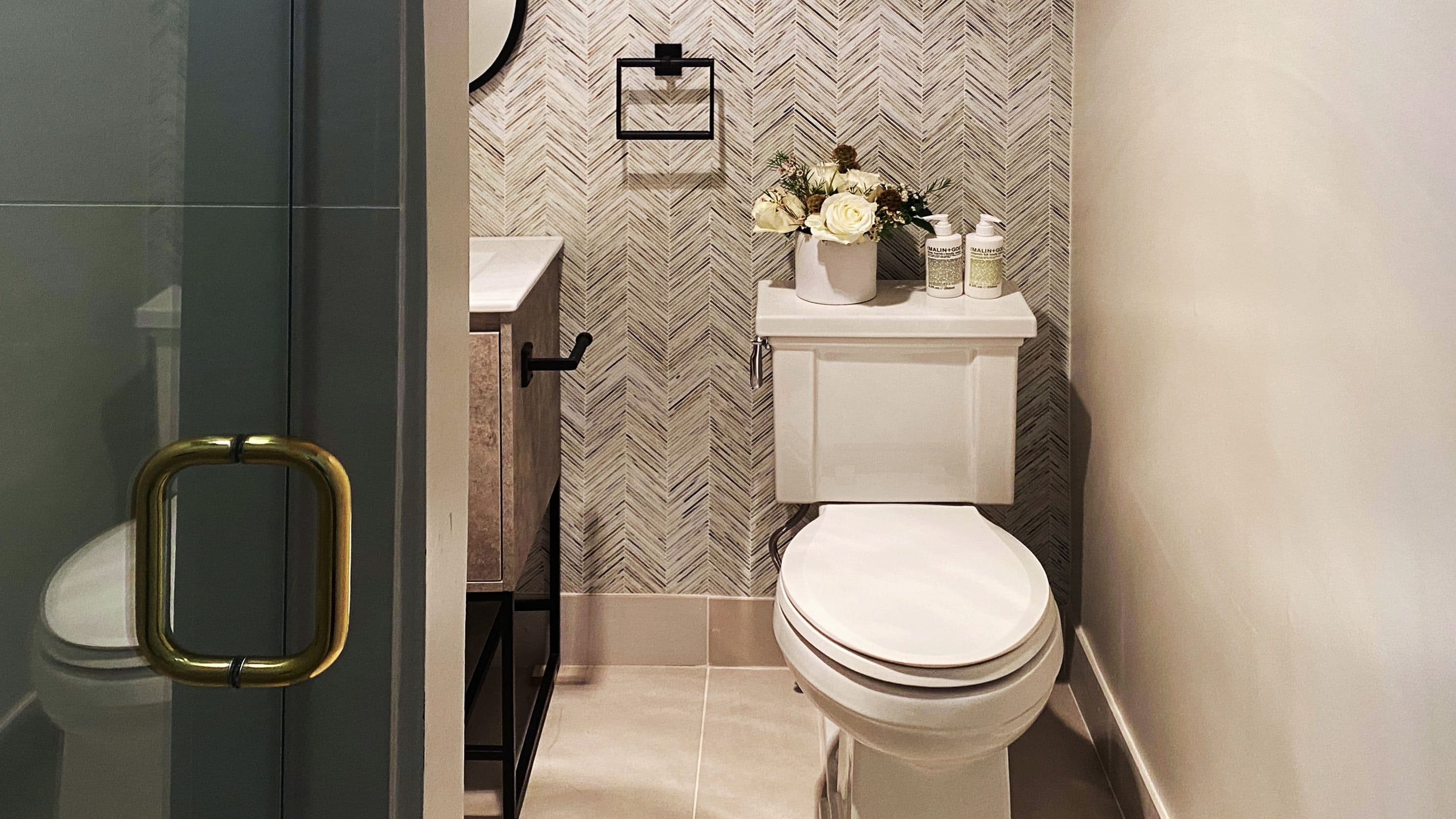 modern bathroom with glass shower door and single toilet