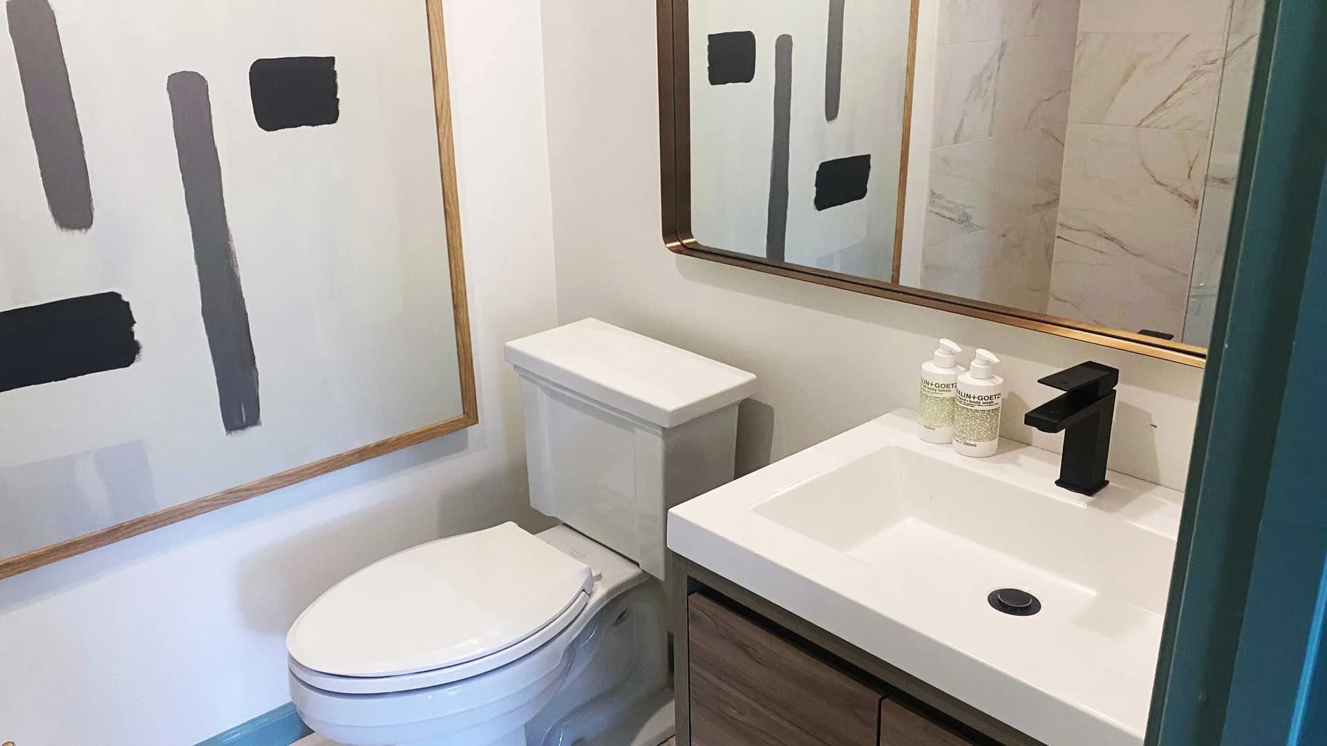 modern bathroom with a faucet sink and tilet