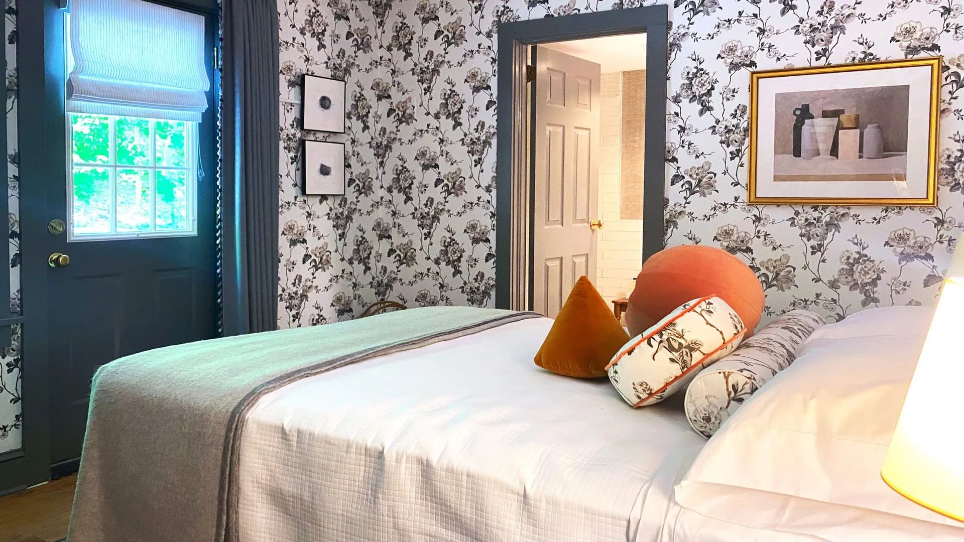 floral wallpaper and private bath access.