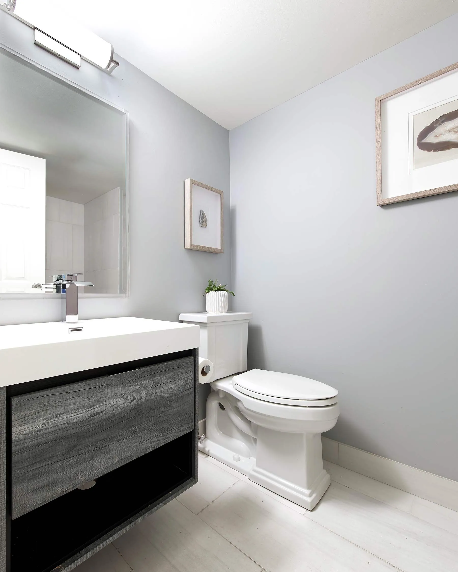 black vanity sink with a single toilet
